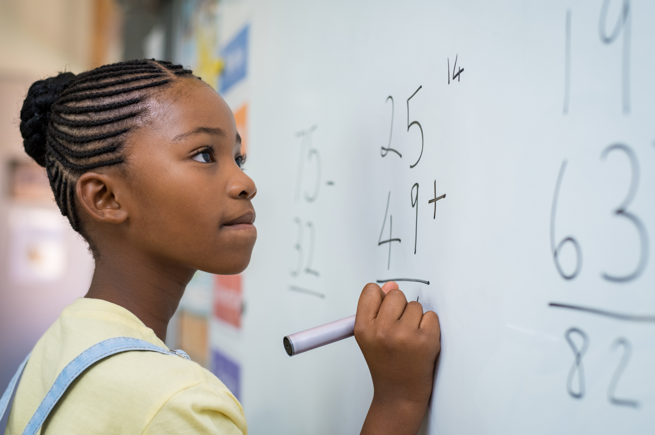 A South African girl doing math.
